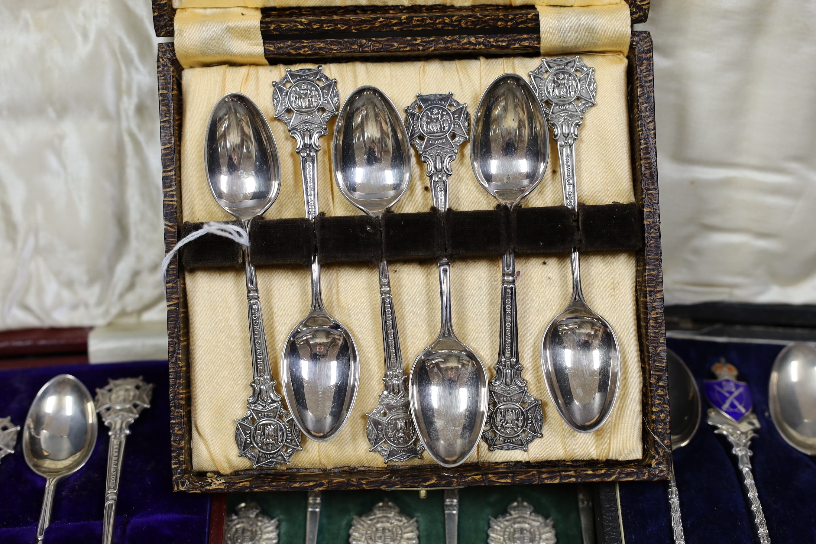 Rifle trophies: a cased set of twelve spoons, two cased sets of silver spoons and a cased set of six plated spoons